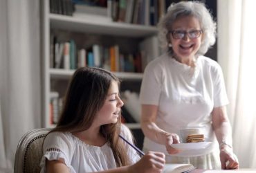 hindi moral story one old women standking and a young girl reading